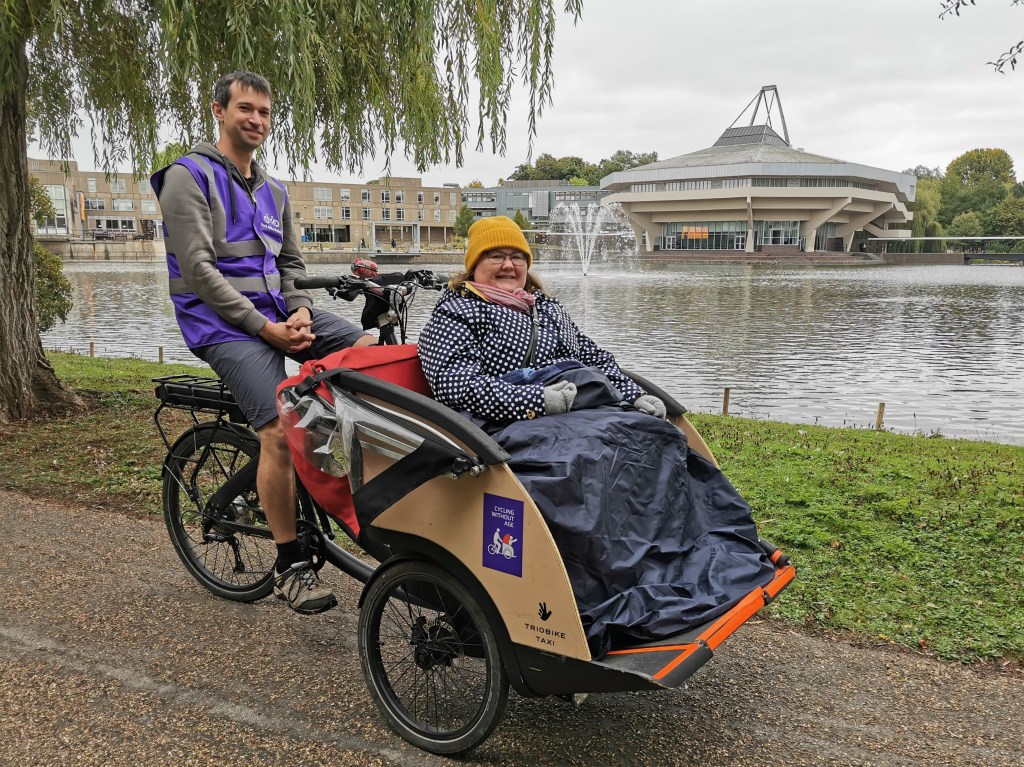 Woman in rickshaw by University lake