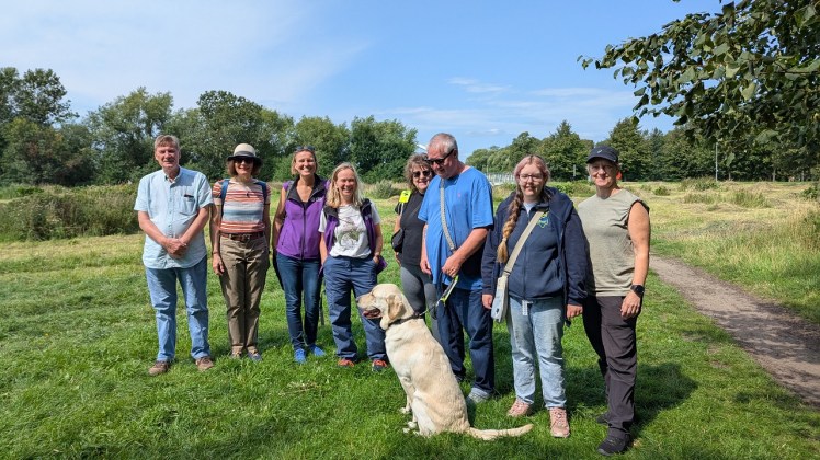 A group of people gathered for a Nature Walk