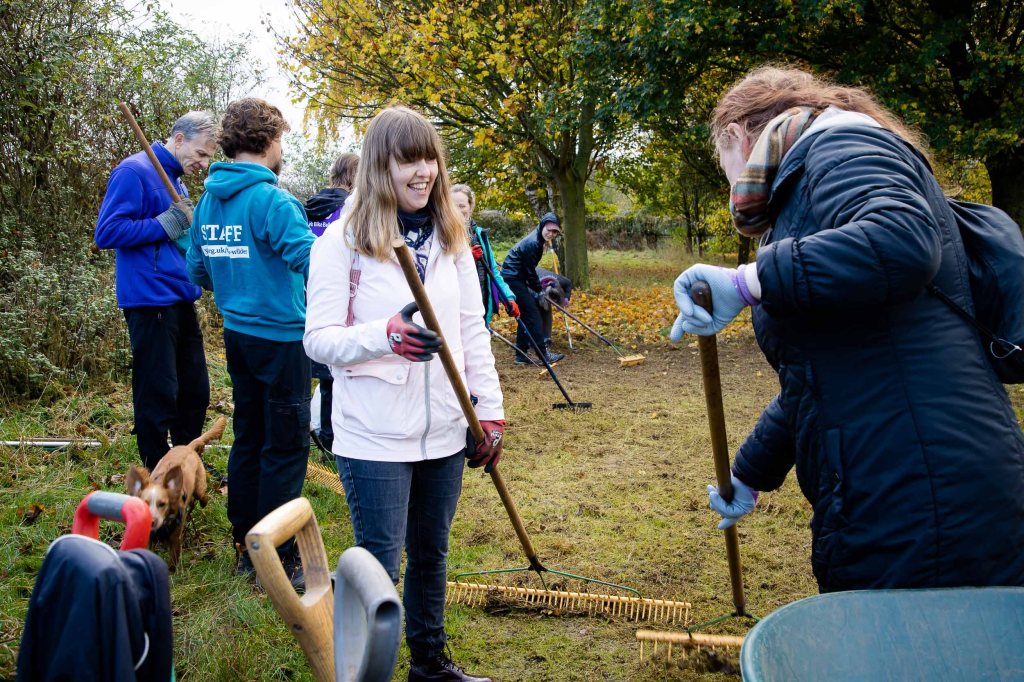 People smiling and gardening